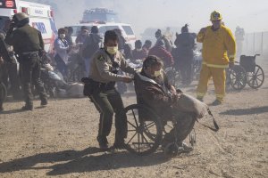 A Riverside County sheriff’s deputy helps evacuate a resident from the Riverside Heights Healthcare Center on Oct. 30 in Jurupa Valley. (Credit: Gina Ferazzi/ Los Angeles Times)