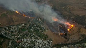 A brush fire is seen burning in Simi Valley on Oct. 30, 2019. (Credit: KTLA)