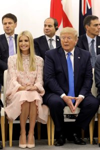Advisor to the U.S. President Ivanka Trump sits with her father U.S. President Donald Trump during an event on the theme "Promoting the place of women at work" on the sidelines of the G20 Summit in Osaka, Japan, on June 29, 2019. (Credit: DOMINIQUE JACOVIDES/AFP/Getty Images)