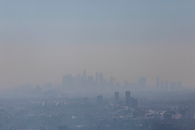 The Los Angeles skyline is seen through smoke as the Getty fire burns in the Brentwood area on Oct. 28, 2019. (Credit: APU GOMES/AFP via Getty Images)