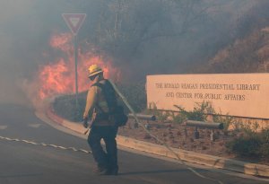 Firefighters battle to protect the Reagan Library from the Easy Fire in Simi Valley on Oct. 30, 2019. (Credit: MARK RALSTON/AFP via Getty Images)