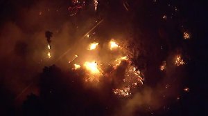 A home is seen in flames as the Maria Fire tears through communities near Santa Paula and Somis in Ventura County on Oct. 31, 2019. (Credit: KTLA)