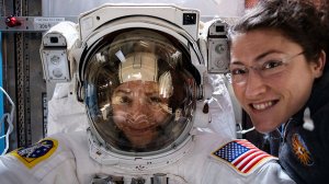 NASA astronaut Christina Koch (right) poses for a portrait with fellow Expedition 61 Flight Engineer Jessica Meir of NASA who is inside a U.S. spacesuit for a fit check in this undated photo provided by the agency.