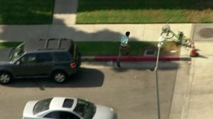 A man who was being pursued by the California Highway Patrol runs out of the vehicle he was in on Oct. 17, 2019. (Credit: KTLA)