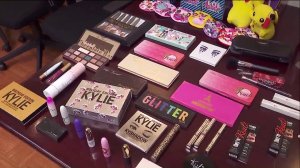 Counterfeit makeup found by L.A. City officials is displayed during a news conference on Nov. 26, 2019. (Credit: KTLA)