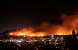 A long exposure photo shows the Maria Fire as it races across a hillside in Santa Paula on Nov. 1, 2019. (Credit: Josh Edelson / AFP via Getty Images)