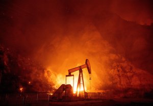 Flames from the Maria Fire burn through an oil field in Santa Paula on Oct. 31, 2019. (Credit: JOSH EDELSON/AFP via Getty Images)