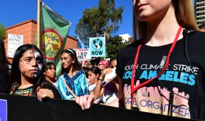 Activists march through downtown Los Angeles in a climate rally where teenage Swedish activist Greta Thunberg addressed the crowd on Nov. 1, 2019. (Credit: Frederic J. Brown / AFP / Getty Images)