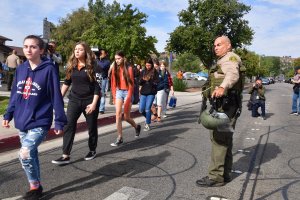 Students line up after a shooting at Saugus High School in Santa Clarita on Nov. 14, 2019. (Credit: FREDERIC J. BROWN/AFP via Getty Images)