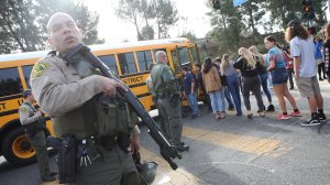 Students evacuate from Saugus High School onto a school bus after a shooting at the school left two students dead and three wounded on Nov. 14, 2019, in Santa Clarita. (Credit: Mario Tama/Getty Images)