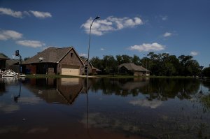 Floodwaters surround homes on Sept. 7, 2017 in Richwood, Texas, over a week after Hurricane Harvey hit the state. (Credit: Justin Sullivan/Getty Images)