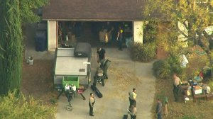 Authorities search for evidence after serving a warrant at the home of the suspected Saugus High School shooter in Santa Clarita on Nov. 14, 2019. (Credit: KTLA)