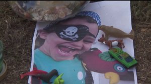Omar Awaida, 3, was killed in a hit-and-run crash along with his parents that occurred on Oct. 31, 2019. He appears in a photo placed at a memorial.