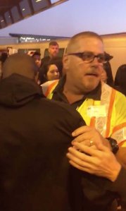 John O'Connor, a supervisor at Bay Area Rapid Transit, hugs a man he pulled from the tracks just as a train was arriving at the station in Oakland, California, on Nov. 3, 2019. (Credit: Tony Badilla/Twitter via CNN)