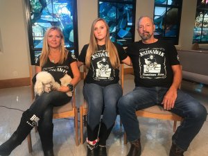 Victoria Rose Meek, center, sits with her mother, Lauren Lynn, and father, Roger in November 2019. (Credit: Paul Vercammen/CNN)