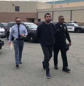 Barstow police released this photo of Brandon Yaag being escorted away in handcuffs by police on Dec. 18, 2019.