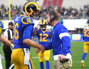 Los Angeles Rams head coach Sean McVay congratulates quarterback Jared Goff after a touchdown in the second half of the game against the Arizona Cardinals at the Memorial Coliseum on Dec. 29, 2019. (Credit: Jayne Kamin-Oncea / Getty Images)