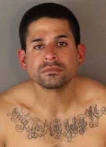 Isaac Villegas appears in a booking photo released by the Riverside Police Department on Dec. 22, 2019.