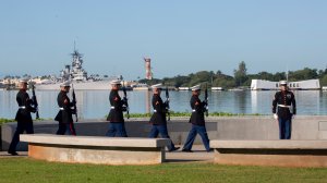 The U.S. Marine Corps gives the rifle salute as Pearl Harbor Commemorates the 78th Anniversary Of World War II Attacks as Pearl Harbor Commemorates the 78th Anniversary Of World War II Attacks at the Pearl Harbor National Memorial on December 7, 2019 in Honolulu, Hawaii. (Credit: Kat Wade/Getty Images)