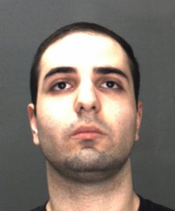 Justin Moshe is seen in a booking photo released Dec. 4, 2019, by the San Bernardino County Sheriff's Department.