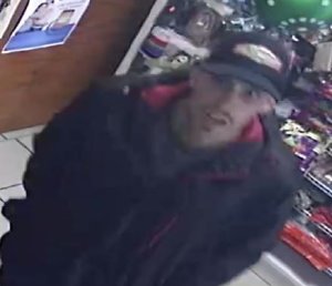 Police are seeking the man pictured in this surveillance photo in connection with a robbery at a Santa Ana mini market on Dec. 1, 2019. (Credit: Santa Ana Police Department)
