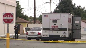 Police investigate the scene of an armored car robbery in South Gate on Dec. 22, 2019. (Credit: KTLA)