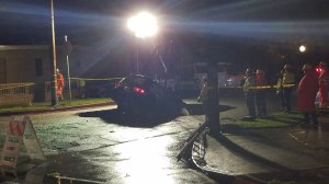 A vehicle that plunged into a sinkhole in Studio City is towed out on Feb. 18, 2017. (Credit: KTLA)