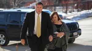 Melodie Gliniewicz, accompanied by her attorney, turns herself into the Lake County Sheriff's Office following her indictment Jan. 27, 2016. (Stacey Wescott / Chicago Tribune)