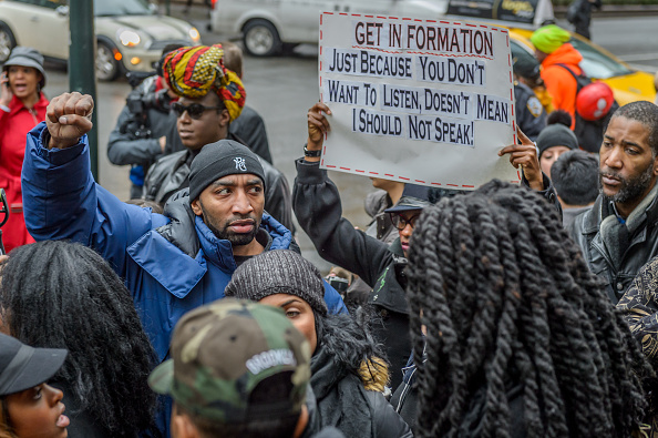 An organizer holds a fist up as a sign of victory of the TEAM #FORMATION at the anti-Beyonce Protest after their counterpart protest contingent did not show up. (Photo by Erik McGregor/Pacific Press/LightRocket via Getty Images)