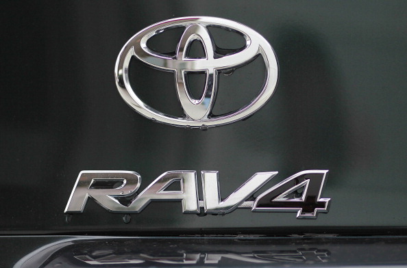 OAKLAND, CA - FEBRUARY 24: The Toyota RAV4 logo is displayed on the back of a brand new RAV4 at a Toyota dealership on February 24, 2011 in Oakland, California. Toyota announced today that it will recall nearly 2.2 million vehicles that have floor mats that could interfere with their gas pedals. The list of cars to be recalled includes 761,000 2006-10 RAV4, 603,000 2003-09 4Runner models and 17,000 2008-11 Lexus LX 570 models. (Photo by Justin Sullivan/Getty Images)