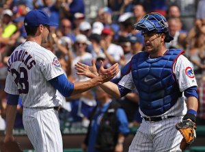 Kyle Hendricks #28 and Miguel Montero #47 of the Chicago Cubs celebrate a win over the Philadelphia Phillies at Wrigley Field on May 28, 2016 in Chicago, Illinois. The Cubs defeated the Phillies 4-1. (Photo by Jonathan Daniel/Getty Images)