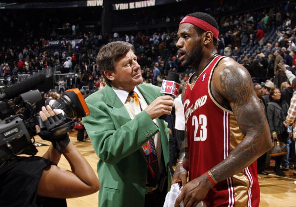 Craig Sager, broadcaster for NBA TV, interviews LeBron James #23 of the Cleveland Cavaliers after a win against the Atlanta Hawks on December 29, 2009 at Philips Arena in Atlanta, Georgia. (Photo by Joe Murphy/NBAE via Getty Images)