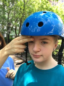 Bike helmets should cover the front of the child's head, with a distance of two fingers between the eyes and helmet.