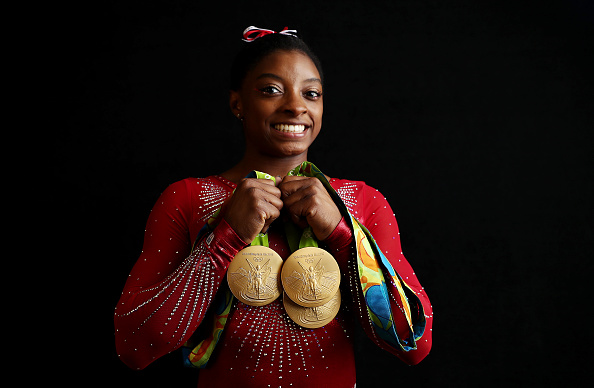 Portrait of Team USA gymnast Simone Biles posing with 4 Gold medals and 1 Bronze medal during photo shoot at Main Press Centre in Barra Olympic Park. Rio de Janeiro, Brazil/ (Photo by Simon Bruty /Sports Illustrated/Getty Images)