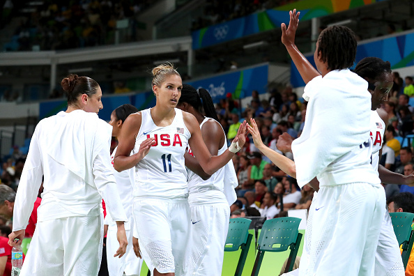 Diana Taurasi #12, Elena Delle Donne #11 and Tamika Catchings #10 of United States celebrate a play during the Women's Gold Medal Game between United States and Spain on Day 15 of the Rio 2016 Olympic Games at Carioca Arena 1 on August 20, 2016 in Rio de Janeiro, Brazil. (Photo by Tom Pennington/Getty Images)