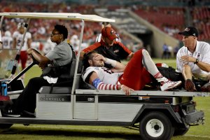TAMPA, FL - SEPTEMBER 10: Quarterback Drew Hare #12 of the Northern Illinois Huskies is taken off the field after being injured against the South Florida Bulls during the 3rd quarter at Raymond James Stadium on September 10, 2016 in Tampa, Florida. (Photo by Jason Behnken / Getty Images)