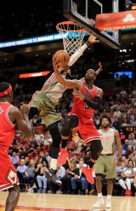 Dwyane Wade #3 of the Chicago Bulls shoots around Willie Reed #35 of the Miami Heat during the first quarter of the game at American Airlines Arena on November 10, 2016 in Miami, Florida. NOTE TO USER: User expressly acknowledges and agrees that, by downloading and or using this photograph, User is consenting to the terms and conditions of the Getty Images License Agreement. (Photo by Rob Foldy/Getty Images)