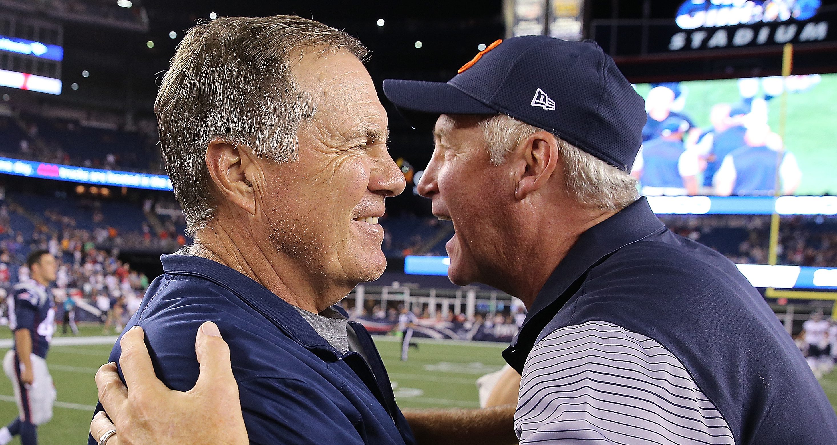 Bill Belichick and John Fox shake hands after their preseason game at Gillette Stadium in Foxboro, Massachusetts. (Photo by Jim Rogash/Getty Images)