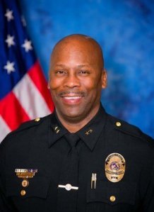 Ferguson announced it hired an interim police chief -- a move coming after the U.S. Justice Department examined the shooting of Michael Brown and determined the mostly white police contingent had discriminated against African-Americans in the Missouri city. Andre Anderson, previously a commander with police in Glendale, Airzona was introduced by the city Wednesday morning, July 22, 2015.