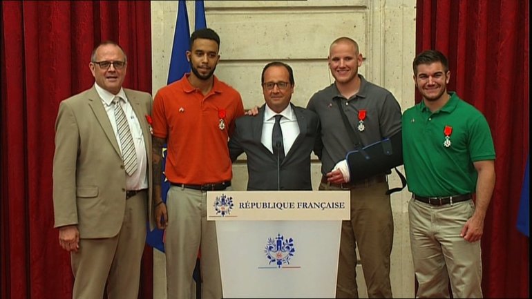 French president Francois Hollande meets with the heroes who thwarted the French train attack on Friday, August 21, 2015. Image taken from a screengrab of a pool feed.