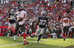 TAMPA, FL - NOVEMBER 15: Jameis Winston #3 of the Tampa Bay Buccaneers scores a touchdown during a game against the Dallas Cowboys at Raymond James Stadium on November 15, 2015 in Tampa, Florida. (Photo by Mike Ehrmann/Getty Images)