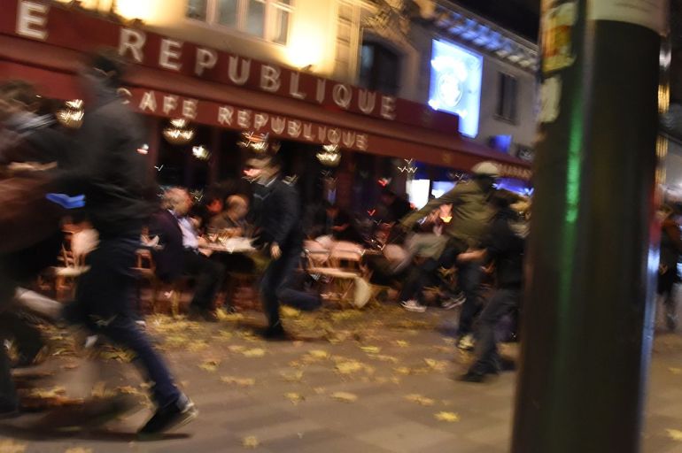 People run after hearing what is believed to be explosions or gun shots near Place de la Republique square in Paris on November 13, 2015. At least 18 people were killed in several shootings and explosions in Paris today, police said.  AFP PHOTO / DOMINIQUE FAGET        (Photo credit should read DOMINIQUE FAGET/AFP/Getty Images)
