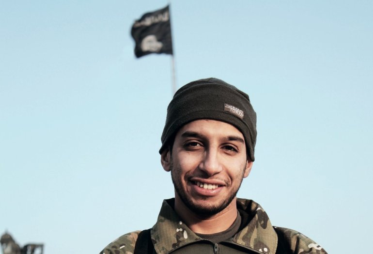 An undated picture taken on November 16, 2015 from the February 2015 issue 7 of the Islamic State (IS) online English-language magazine Dabiq, purportedly shows 27-year-old Belgian IS group leading militant Abdelhamid Abaaoud, also known as Abu Umar al-Baljiki and believed to be the mastermind of a jihadist cell dismantled in Belgium in January 2015, posing at an undisclosed location to illustrate an interview he gave to the magazine, claiming to have rejoined the extremist group in Syria. Flemish-language newspaper De Standaard reported that Brahim Abdeslam, one of the attackers who blew himself up during the Paris attacks last week, had links to Abaaoud, a Belgian of Moroccan descent who allegedly fought with the IS jihadist group in Syria and remains at large.