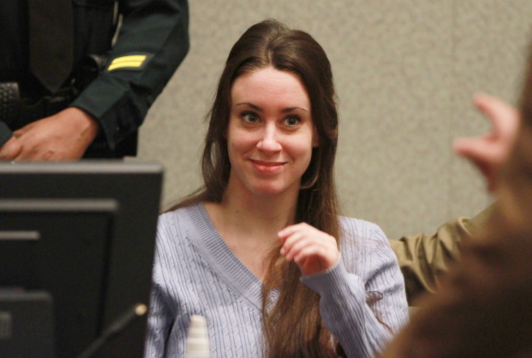 ORLANDO, FL - JULY 07: Casey Anthony smiles before the start of her sentencing hearing on charges of lying to a law enforcement officer at the Orange County Courthouse July 7, 2011 in Orlando, Florida. Anthony was acquitted of murder charges on July 5, 2011 but will serve four, one-year sentences on her conviction of lying to a law enforcement officer. She will be credited for the nearly three-years of time served and good behavior and will be released July 13. (Photo by Joe Burbank-Pool/Getty Images)