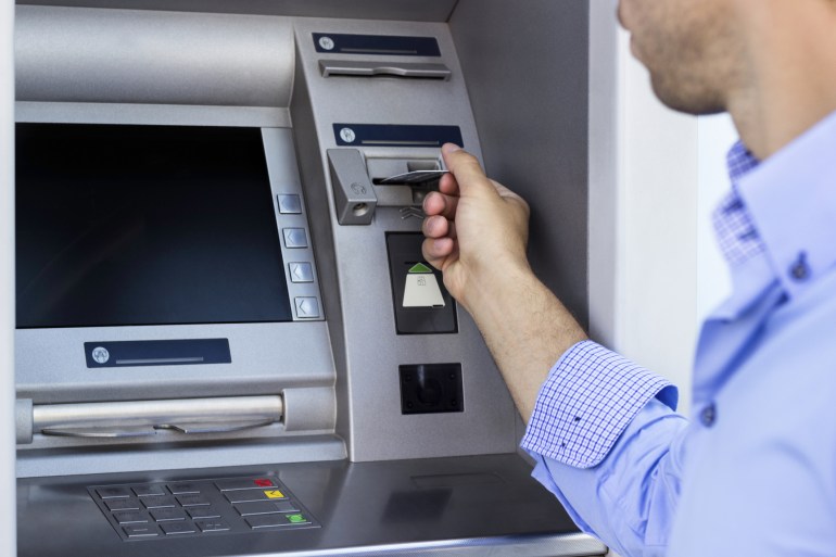 Man using a ATM