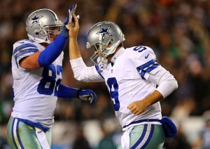 PHILADELPHIA, PA - DECEMBER 14: Tony Romo #9 of the Dallas Cowboys high fives Jason Witten #82 after a touchdown in the first quarter against the Philadelphia Eagles at Lincoln Financial Field on December 14, 2014 in Philadelphia, Pennsylvania. (Photo by Elsa/Getty Images)