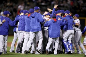 OAKLAND, CA - SEPTEMBER 23: The Texas Rangers celebrate after they clinched the American League West Division Title by beating the Oakland Athletics at Oakland-Alameda County Coliseum on September 23, 2016 in Oakland, California. (Photo by Ezra Shaw/Getty Images)