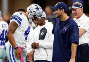ARLINGTON, TX - OCTOBER 09: (L-R) Dak Prescott #4, quarterback of the Dallas Cowboys talks with injured quarterback Tony Romo #8 prior to the game against the Cincinnati Bengals at AT&T Stadium on October 9, 2016 in Arlington, Texas. (Photo by Wesley Hitt/Getty Images)