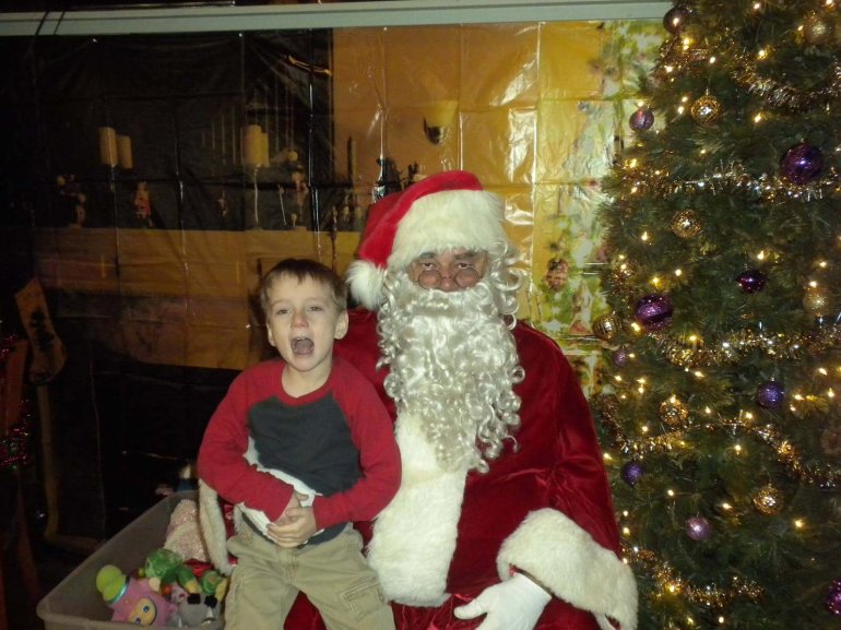 Cavin Chatham takes a picture with a regular mall Santa in 2015 (Pic: Richard Chatham)