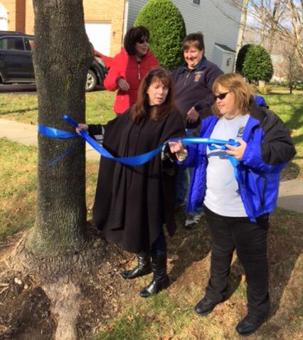 Law enforcement and Officer Leotta's family come together to decorate trees in his memory (PHOTO: MCPD)